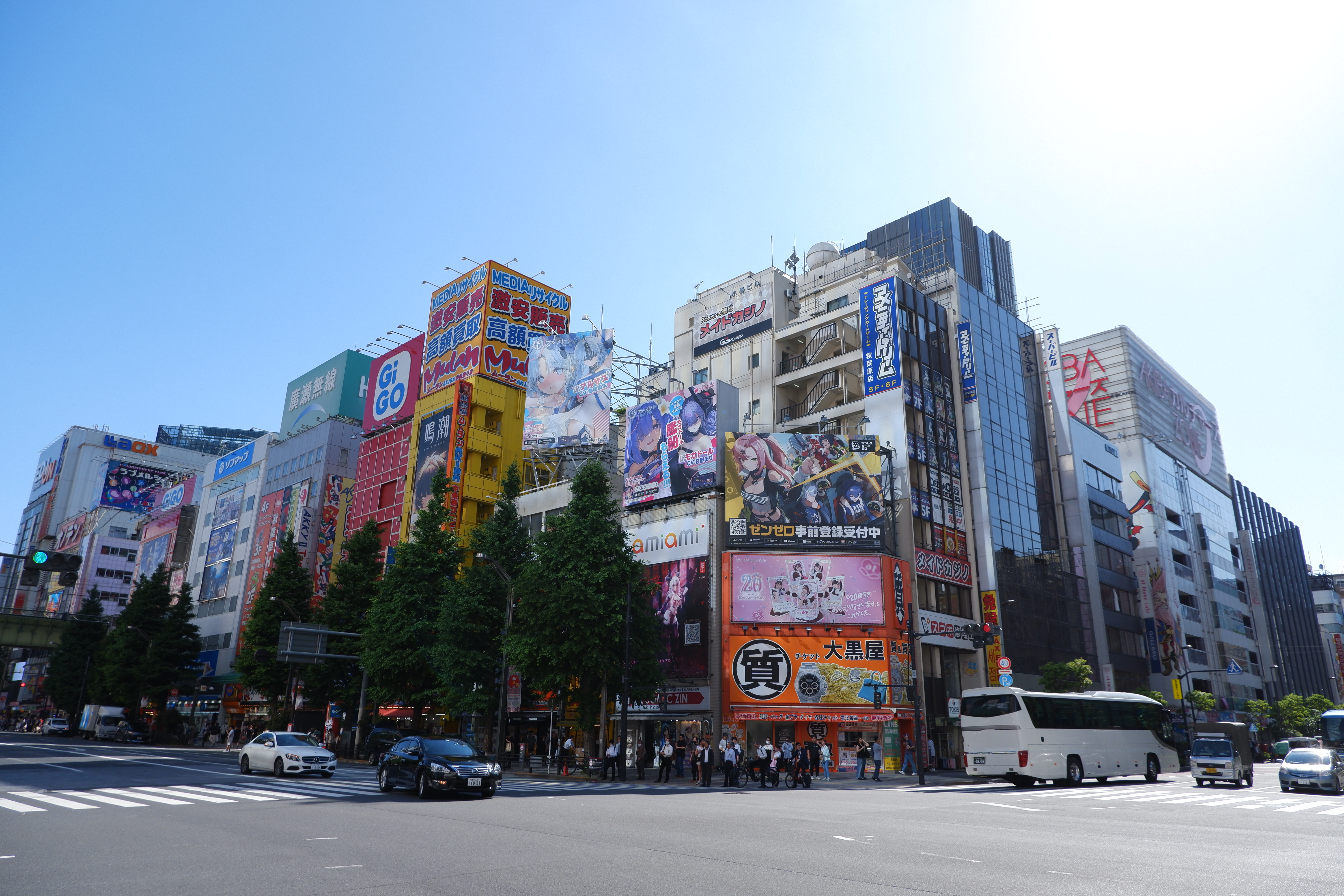 a crossing in Akihabara, Japan, featuring large banners
